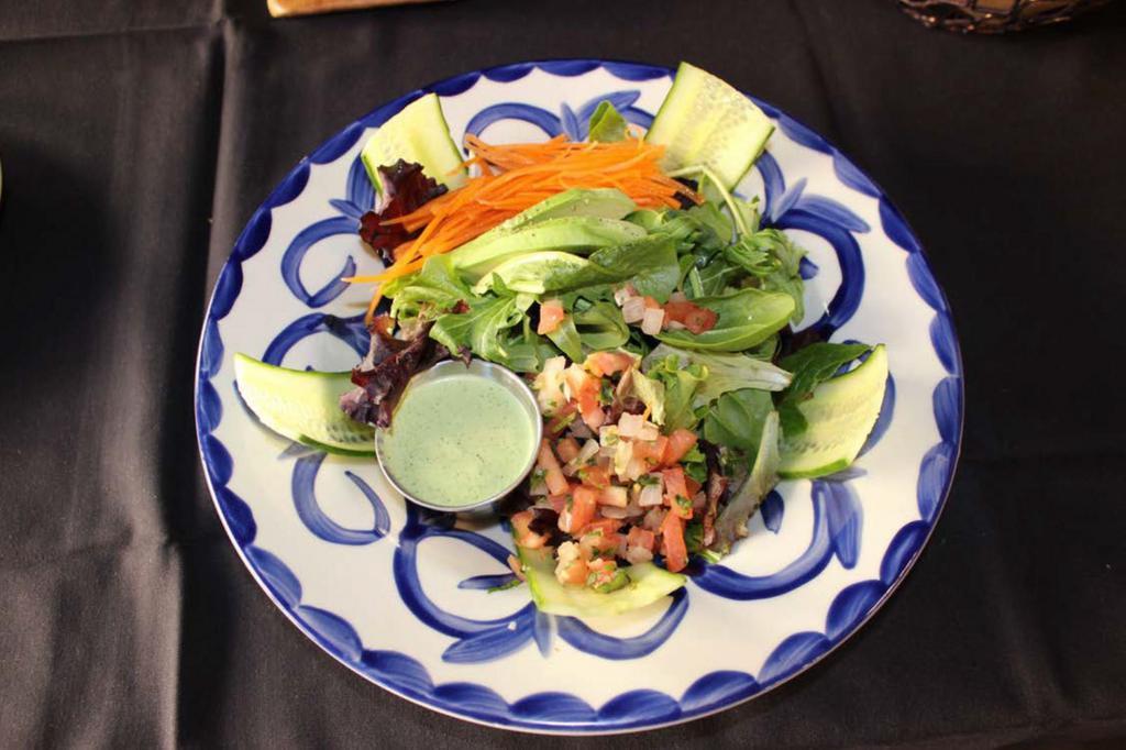El Dorado House Salad · Mixed greens, cucumber, carrots, fresh Hass avocados and pico de gallo with house-made cilantro dressing. Vegan. Gluten-free.