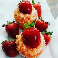 Strawberry Shortcake Cupcake · Strawberry cake topped with a glazed strawberry, streusal crumble, and buttercream frosting.