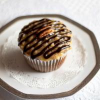 German Chocolate · Rich chocolate cake topped with coconut pecan frosting and drizzled with chocolate ganache. 