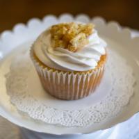 Peach cobbler cupcake · Soft moist peach cake topped with peach cobbler and buttercream frosting 