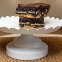 Slutty brownies · 3 layer treat with chocolate chip cookies on the bottom, Oreo cookie in the center and toppe...