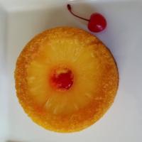Pineapple Upside Down Cake · This classic cake is moist & flavorful with a topping of pineapple rings & cherries.