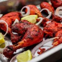 TA1. Tandoor Chicken · Fresh spring chicken marinated in north Indian style in red spice and cooked in charcoal oven.