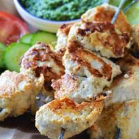 TA3. Chicken Resmi Kabab · Minced chicken seasoned with chopped ginger onions and spices rolled over a skewer and barbe...