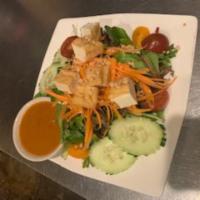Thai Salad · Mixed green, tomatoes, cucumbers, carrots, fried tofu and peanut sauce. Vegetarian.