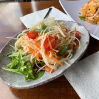 Som Tum · Green papaya with tomatoes, carrots, string beans, peanuts, and garlic in spicy lime sauce. ...