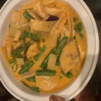 Red Curry · Thai style red curry with bamboo shoot, string beans, bell peppers and basil in coconut milk...