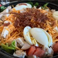 Chicken Cobb Salad · Spring Mix, Chicken, Egg, Tomatoes, Cucumbers, Bacon, and Cheddar Cheese with Chipotle Ranch...