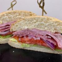 The Italian Cold Sandwich · Ham, Salami, Red Onion, Tomato, Romaine Lettuce, Red Wine Vinegar, and Olive Oil. Comes with...