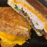 Chipotle Turkey Bacon Panini · Chipotle Ranch, Turkey, Bacon, Cheddar, Red Onion, and Spinach