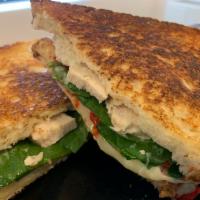 Garlic Chicken Panini · Chicken, Provolone Cheese, Garlic Parm Herb Spread, Roasted Red Peppers, and Spinach