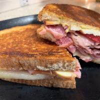 Italian Melt Panini · Ham, Turkey, Salami, Mustard, Red Onion, and Provolone Cheese. Comes with Chips and a Pickle.