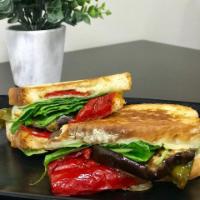 Roasted Vegetable Panini · Roast Eggplant, Spinach, Provolone Cheese, and Roasted Red Peppers. Comes with Chips and a P...