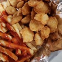 Fried Shrimp Basket · Fried shrimp with cocktail sauce and french fries on the side 