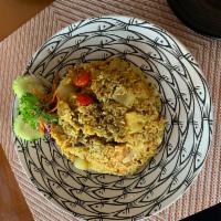 Pineapple Fried Rice · Choice of meat with egg, cherry tomatoes, pineapple, cashew nuts, onions, and curry powder.