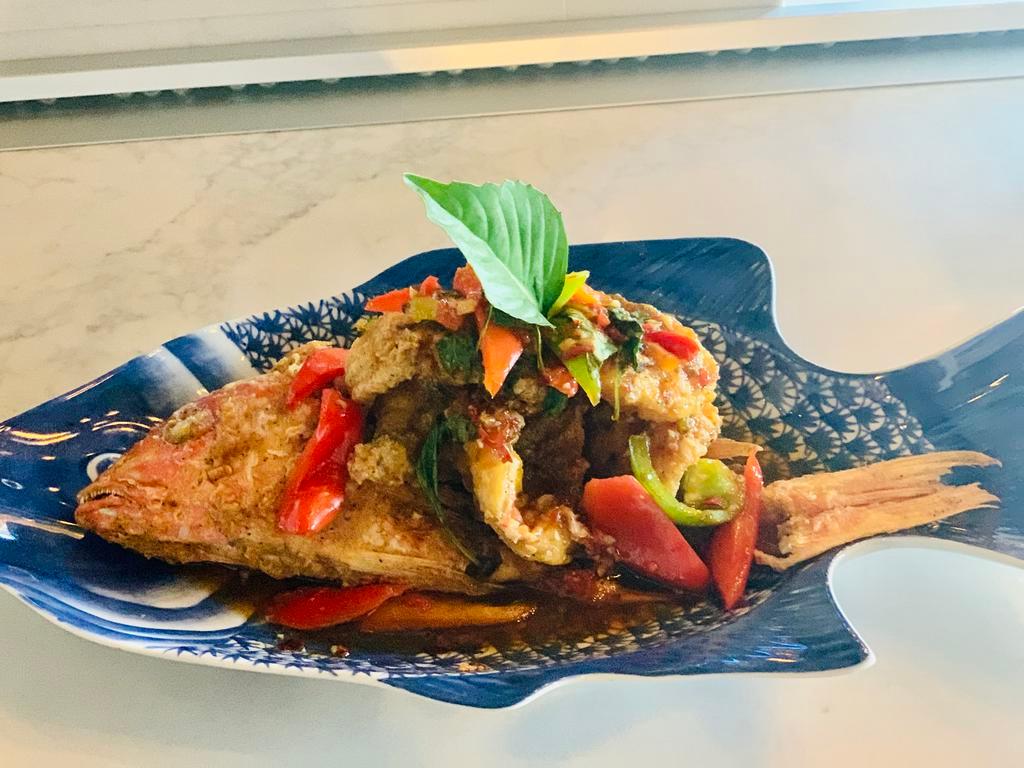 Red Snapper Rad Phrik · Lightly battered deep-fried whole snapper with homemade chili garlic basil sauce.