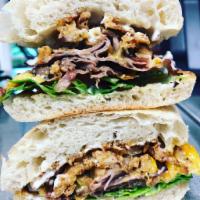 #3 - Beef  · Slow-roasted beef, NY sharp cheddar, tomato, arugula and fried onion straws served with hors...