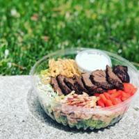 Steak and Greens Salad · Grilled steak, tomato, bacon, blue cheese crumbles, onion straws and blue cheese dressing al...