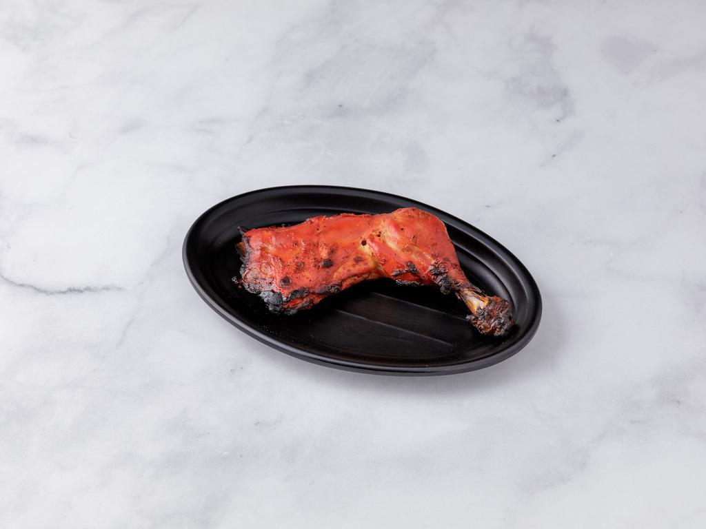 Tandoori Chicken · Spring chicken marinated in yogurt and freshly ground spices and cooked in tandoor.