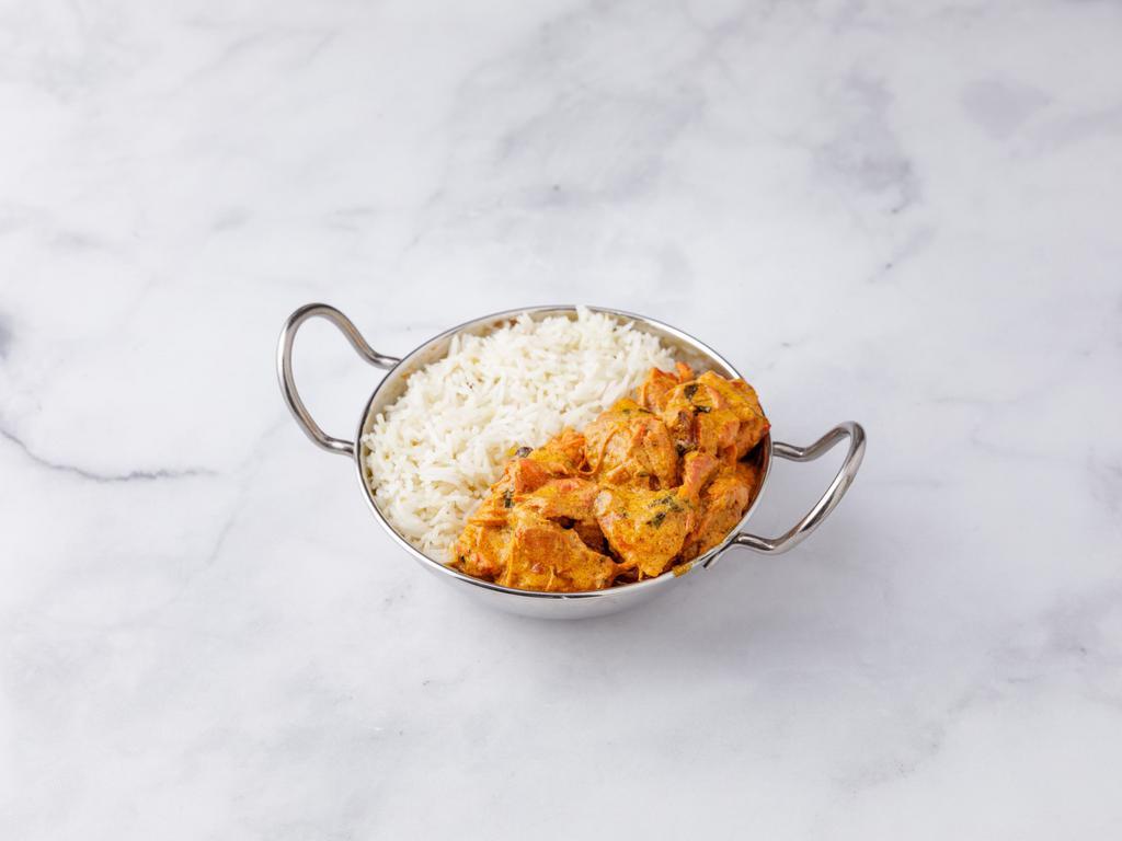 Chicken Tikka Masala · Boneless pieces of chicken cooked in a hot tomato based sauce flavored with fresh Indian herbs. Served with rice or naan.