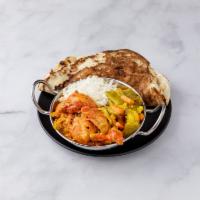 Combination Platter B · Includes chicken tikka masala, 1 vegetable curry, basmati rice, naan or paratha and green sa...