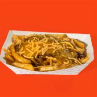 Chili Cheese Fries · Our battered fries topped with Texas style chili and shredded cheddar.