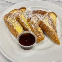 FRENCH TOAST · Fresh baked brioche sliced thick, powdered sugar, butter and syrup.