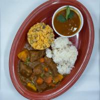 Carne De Res Guisada · Beef stew served with rice and beans. 