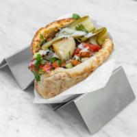 Chicken Shawarma Sandwich · Hummus, White Cabbage, Israeli Salad, Pickles & Tahini