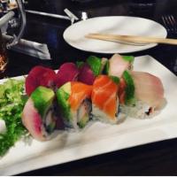 Rainbow Roll · California roll topped with salmon, tuna, shrimp and avocado. Raw.
