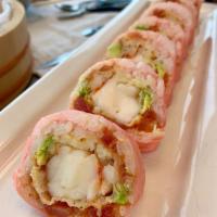 Paradise Roll · Shrimp tempura and spicy tuna wrapped in soy paper and topped with tuna, salmon, avocado and...