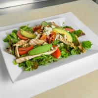 Cobb Salad · Grilled chicken, avocados, bacon, tomatoes, blue cheese and romaine lettuce.