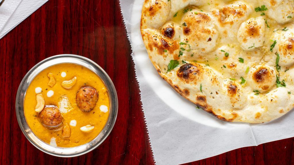Malai Kofta · Hand made dumplings stuffed with cottage cheese, vegetables and herbs, cooked in rich creamy sauce
