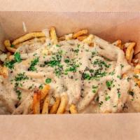 Sharable Poutine · Curds, gravy, & herbs on fresh cut fries.  Serves 4 people