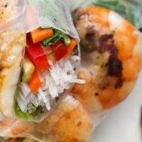 1. Grilled Whole Shrimp Spring Roll · Tom nuong. soft rice paper roll. Served with cilantro, lettuce, cucumber, sour carrots and p...