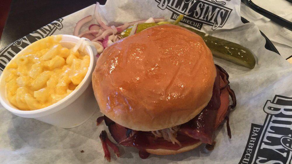 Smoked BBQ Sandwich · A quarter pound sandwich which Includes one side, pickle, pepper and onion.