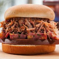 The Heisman Sandwich · Our most celebrated sandwich piled with some bologna, hot link and your choice of pulled por...