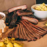 The Running Back · 4 ribs and 2 sides. Includes pickle, pepper, onion and Texas toast.