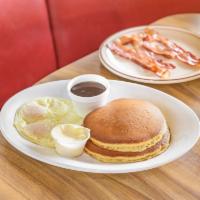 Chelio's Special · 2 pancakes or French toast served with 2 eggs and 4 bacon strips or sausage links or 2 sausa...