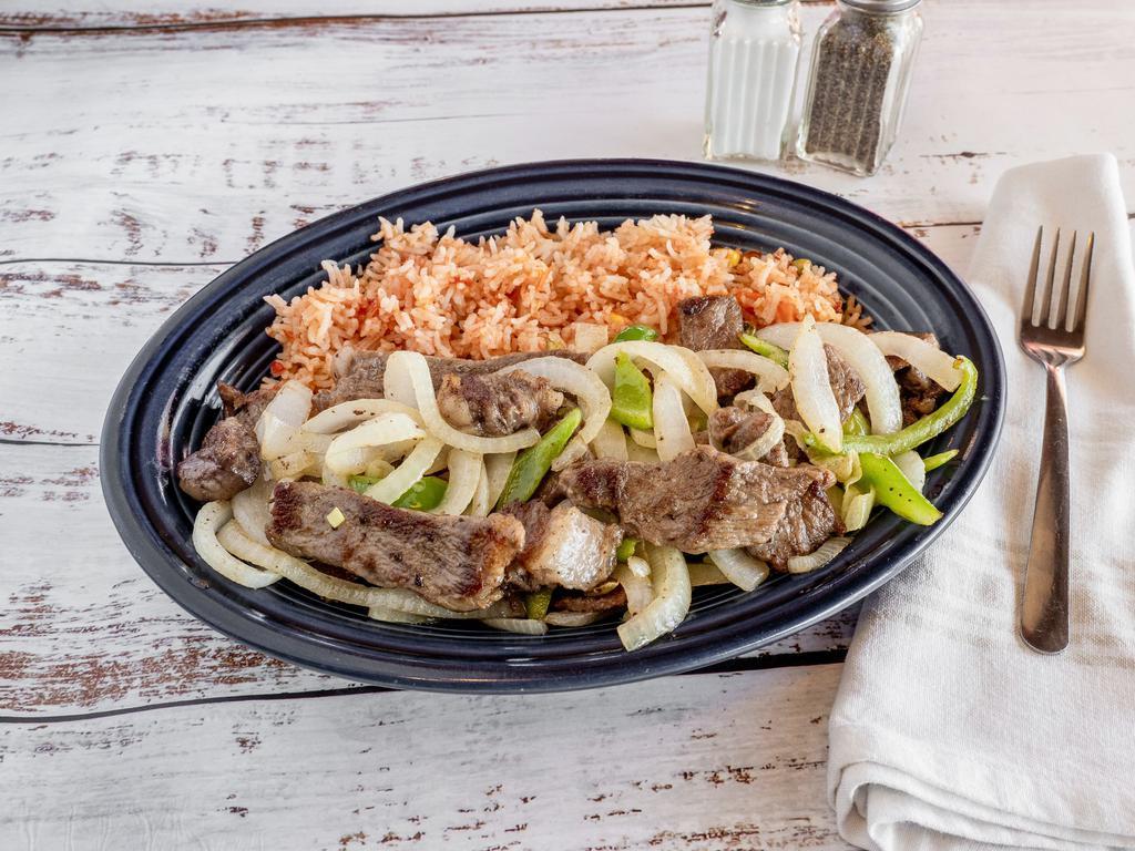 Beef Stir Fry · Sliced steak saute with green pepper, onion and mushroom. Served with rice and garlic toast only.