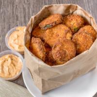 Zucchini Chips · Fried zucchini chips served with tzatziki or hummus.