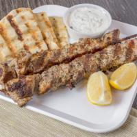 Pork Souvlaki Skewer · Skewer served with toasted pita and your choice of sauce.