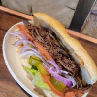 BBQ PULLED BRISKET SANDWICH · Slow Cooked Brisket  Served w, Lettuce, Tomato, Pickles, Red Onion, Sauce of your choice