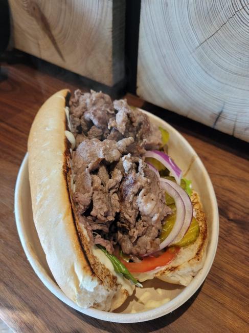 PHILLY STEAK SANDWICH · Tenderized Sliced Beef, Grilled, Served w, Lettuce, Tomato, Pickles, Red Onion, Sauce of your choice