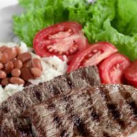 Carne Asada Beef Steak with Rice and Beans · Grilled sliced steak.