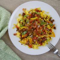 Southwestern Style Scramble · Seasoned ground turkey, bell peppers, roasted corn, and pico de gallo on a bed of scrambled ...