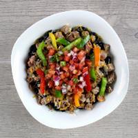 Large Fajita Steak Bowl · Diced sirloin, black beans, bell peppers, and converted rice layered together and topped wit...