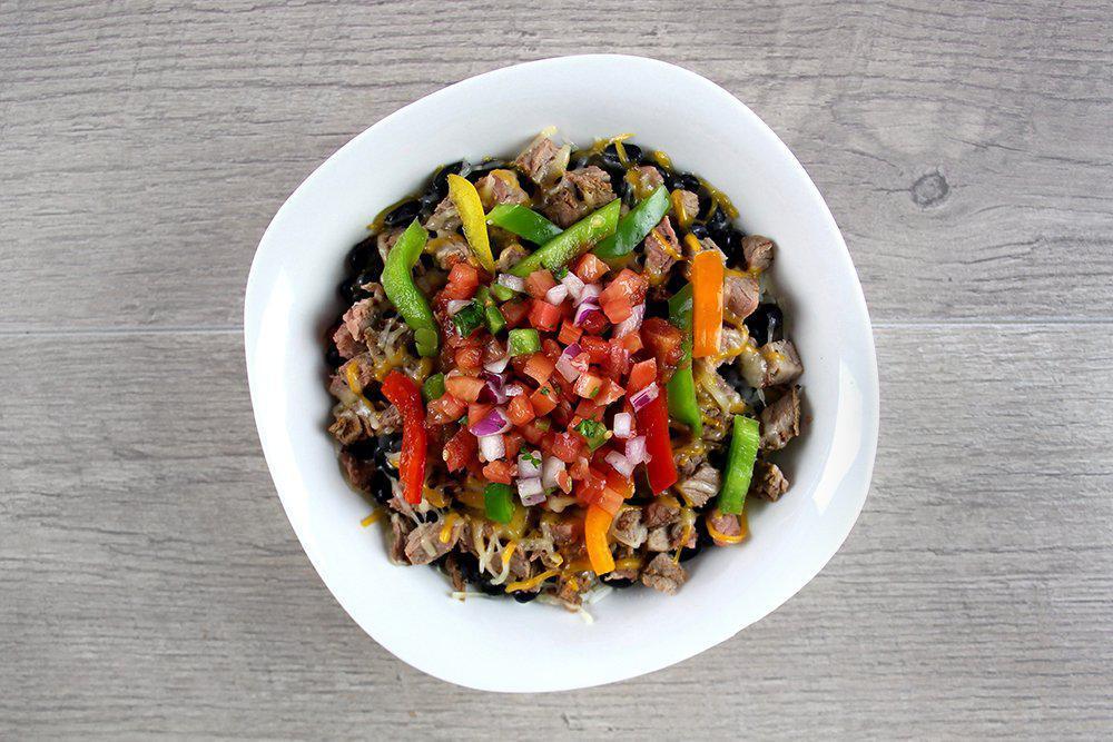 Large Fajita Steak Bowl · Diced sirloin, black beans, bell peppers, and converted rice layered together and topped with 3-cheese blend, pico de gallo, and salsa. 

*Items are pre-made, prepackaged, & delivered cold for home warming. No substitutions or modifications allowed.*

650 Cal        39g Protein        72g Crabs