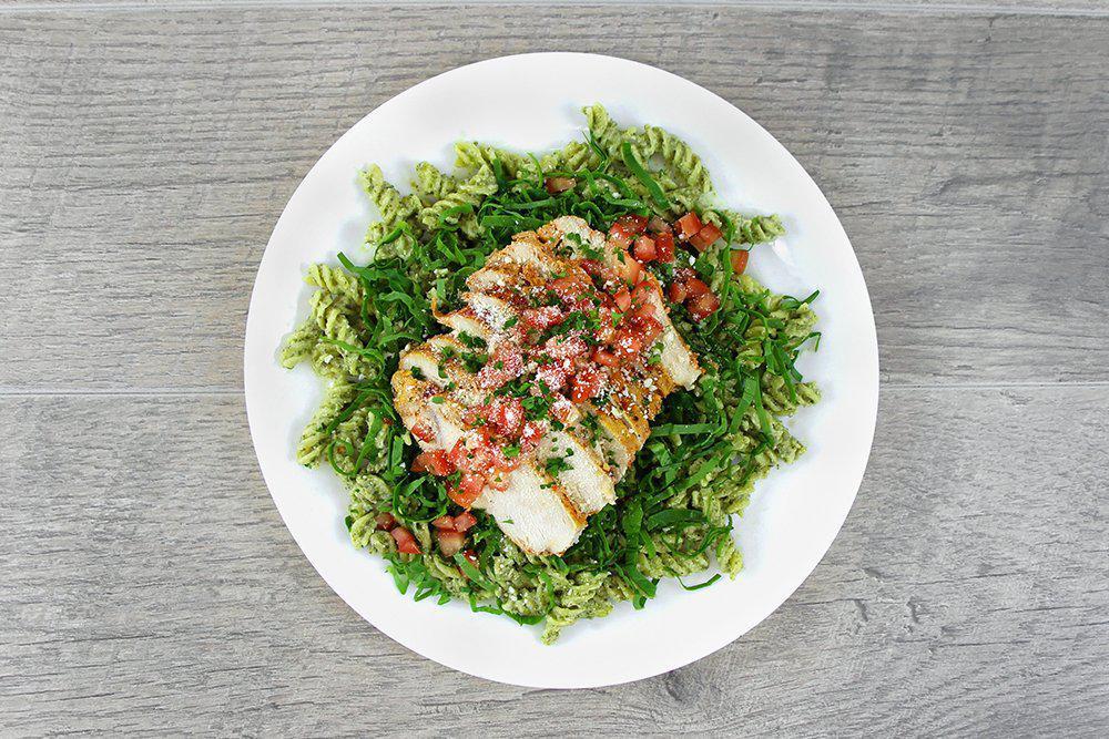 Creamy Pesto Chicken · Baked chicken breast atop a bed of gluten free pasta tossed in a creamy pesto sauce with spinach, topped with diced tomatoes and parmesan. 

*Items are pre-made, prepackaged, & delivered cold for home warming. No substitutions or modifications allowed.*

520 Cal        33g Protein        47g Carbs