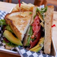 The B.L.A.T. Sandwich · Toasted sourdough, crispy bacon, avocado, lettuce, tomato, and green chile aioli. Add a frie...